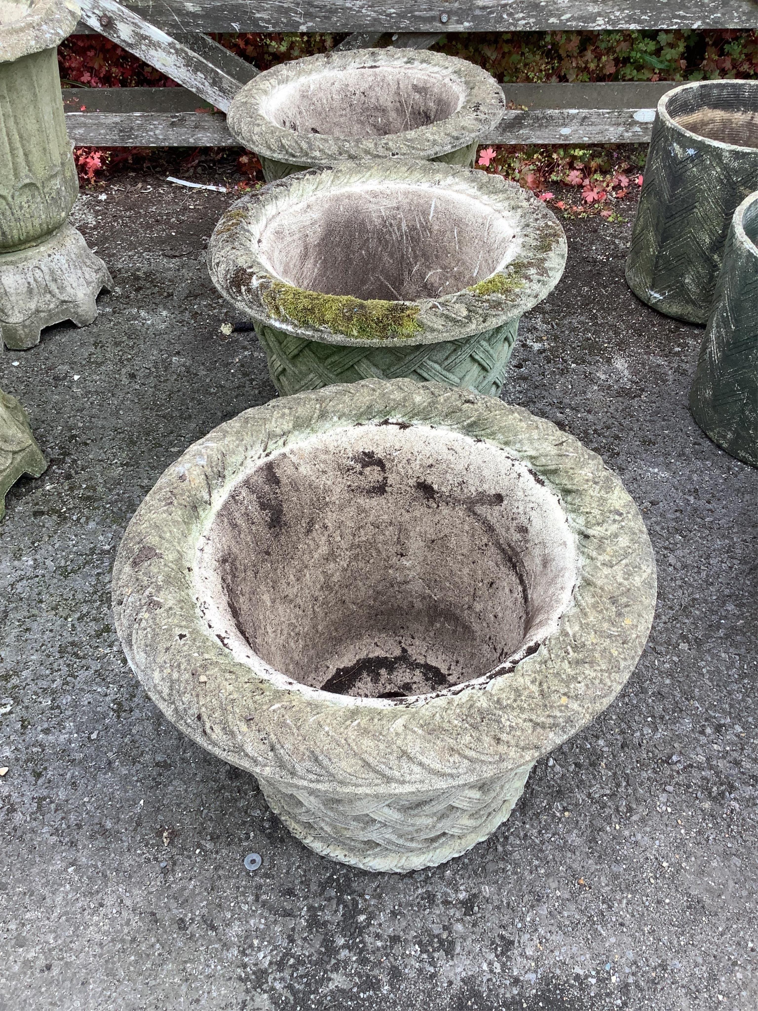 A set of three Haddonstone circular reconstituted stone garden planters, diameter 53cm, height 38cm. Condition - poor